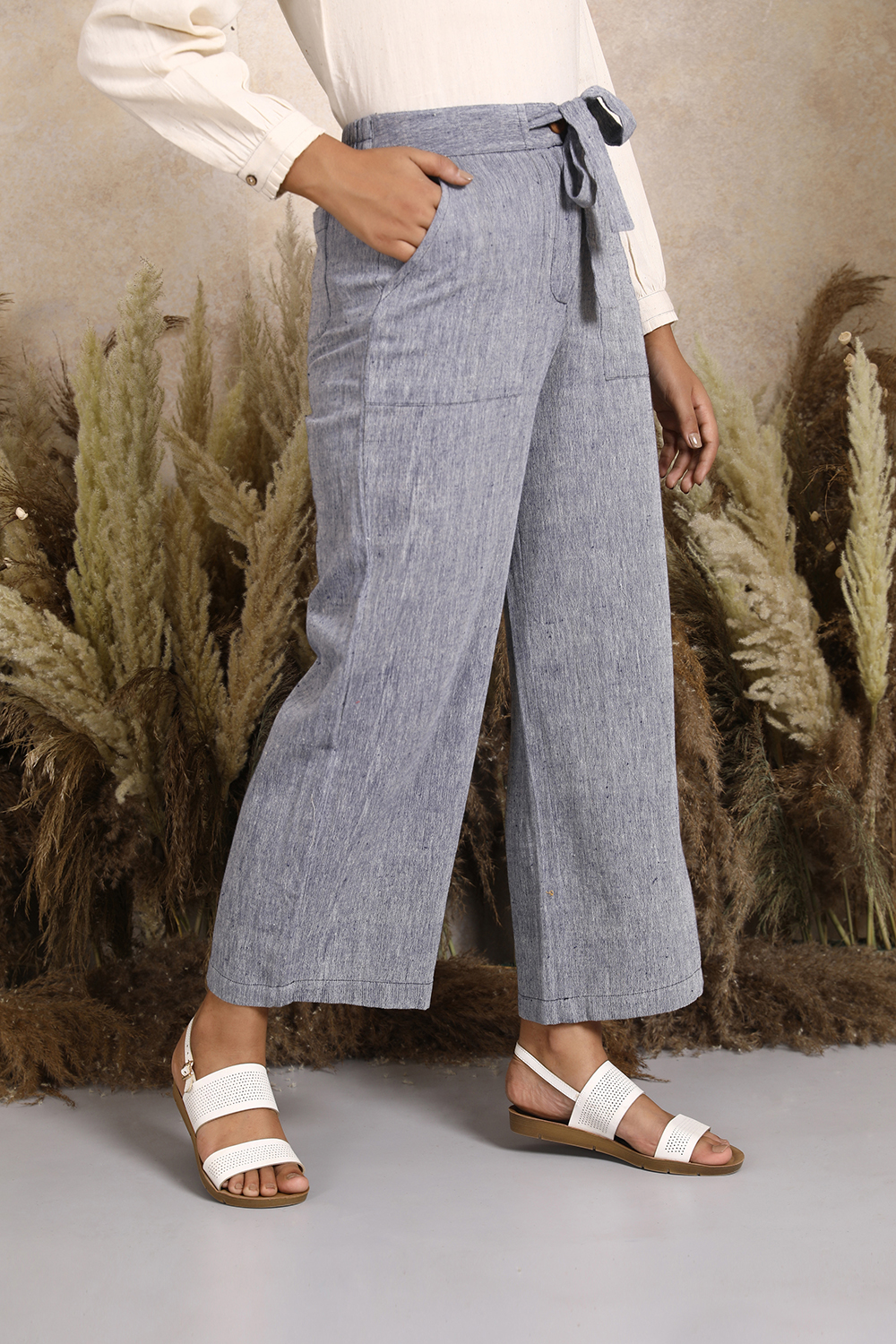 Handwoven Kala Cotton Tie-up Waist Wideleg Pants in Blue. Women's ankle length cotton pants by Vegan clothing brands India