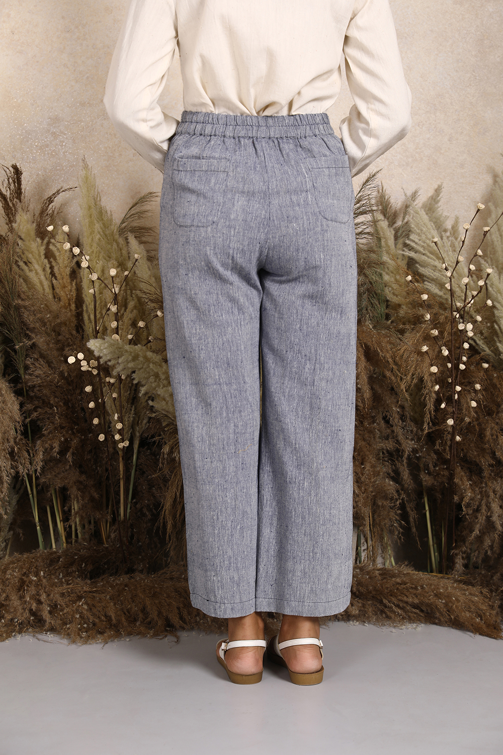 Handwoven Kala Cotton Tie-up Waist Wideleg Pants in Blue Chambray by Lake Peace. Women's sustainable ankle length pants with elasticated waist.