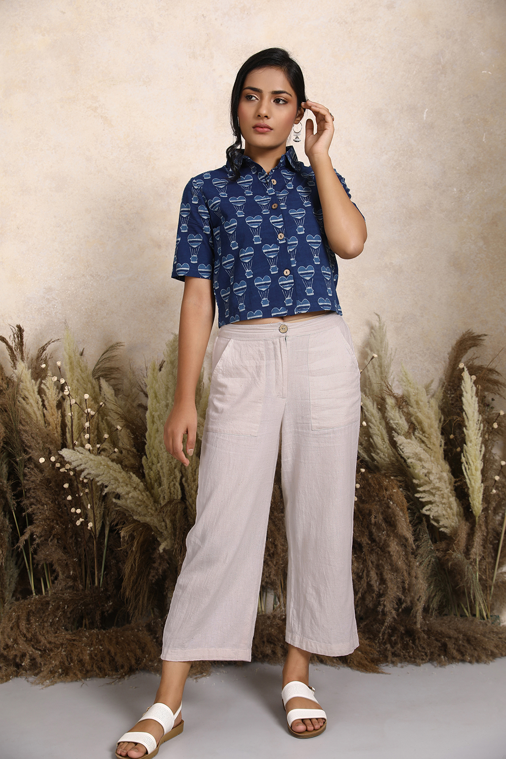 Handwoven Kala Cotton Tie-up Waist Wideleg Pants in White. Women's ankle length cotton pants by Vegan clothing brands India